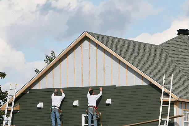Professional Vinyl Siding technician working in Rayland, OH